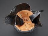 helmet of a soldier with a leather visor on a black background