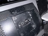 a computer monitor sitting on top of a desk next to a keyboard