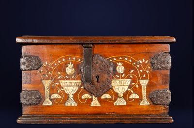 a wooden box that has a design on it