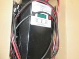 un boîtier contenant quelques fils et un compteur