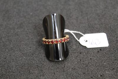 a close up of a ring on a table with a price tag