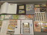 a lot of stamps on a table with a book
