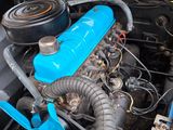 a blue engine in the trunk of a blue car