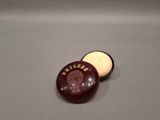 a chocolate donut that is sitting on a table