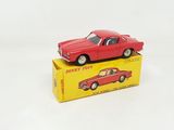 a red toy car sitting on top of a yellow box