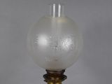 a close up of a lamp on a table with a gray background