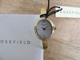 the rosefield watch has a gold case and a white dial