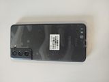 a cell phone that has a sticker on the back of it