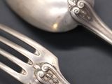 a fork and a spoon sitting on a table