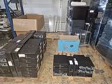 many boxes of electronic equipment on the floor in a warehouse