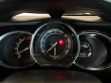 a close up of a car dashboard with a speedometer and gauges
