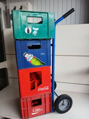 boxes stacked on top of each other with a parrot perched on top of them
