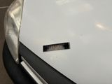 a sticker on the hood of a white car