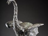 bronze sculpture of an ostrich standing on its hind legs