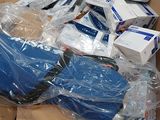 a box full of electronic equipment that is sitting on the floor