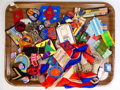 a wooden tray filled with assorted items on top of a table