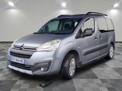 the silver van is parked in a room with a checkered floor
