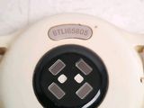 a close up of a nintendo game controller on a table