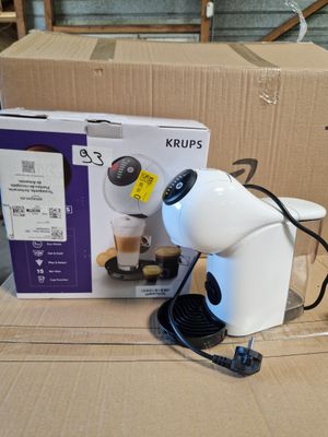 a white robot that is sitting on top of a cardboard box