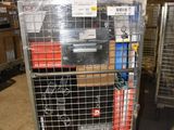 a metal cart with many items in it in a warehouse