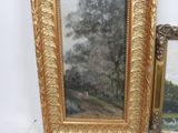 a picture of a painting on the wall next to a mirror