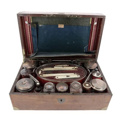an old wooden box with a lot of items inside of it