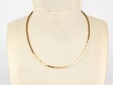 the gold necklace is on a mannequin mannequin mannequin mannequin mannequin mannequin mannequin mannequin manne