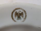a close up of a plate with an eagle on it