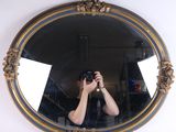 a man taking a picture of himself in a mirror