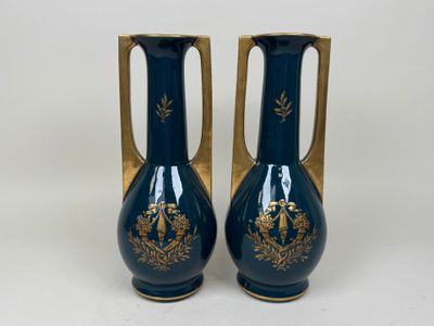 two vases that are sitting on a white surface