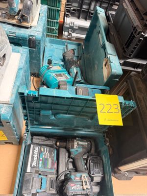 many different tools in a box on the table