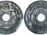 a close up of two silver coins on a white surface