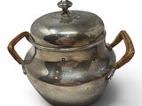 an image of a silver pot with handles and a lid