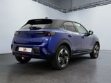 the rear end of a blue toyota c - hr suv parked in a garage