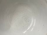 a white bowl sitting on top of a table
