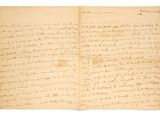 lettre manuscrite écrite à l'encre noire sur une feuille de papier