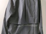 a close up of a jacket on a hanger on a wall