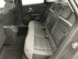 the back seat of a car with a seat belt in it