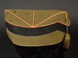 hat with tassel and tassels on top of a mannequin head
