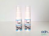 two bottles of time skin care sitting on a table