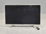 an image of a flat screen tv sitting on top of a white floor