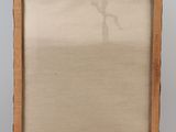 an easel with a painting on it sitting on a wooden stand