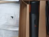a box that has a microphone in it and a phone in it