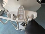 a close up of a chair with a remote control on it