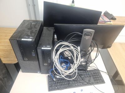 a desktop computer sitting on top of a desk next to a keyboard and monitor