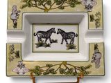 an image of a plate with a picture of two zebras on it