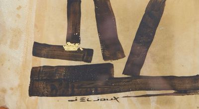 une photo d'un morceau de bois sur lequel figurent des inscriptions