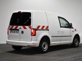 the back end of a white van with a red and white stripe on it