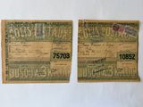 two pieces of old paper with stamps on them sitting on a table