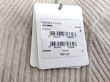 a tag on a sweater that is attached to a sweater